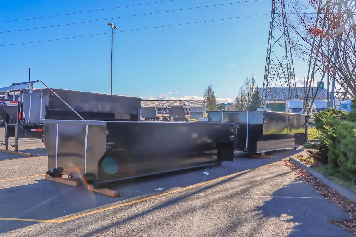 Roll-off dumpster ready for waste disposal at job site for 15 Yard Dumpster Rental in Grants Pass